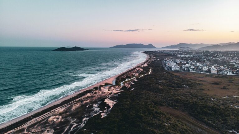 a beach with a town by it