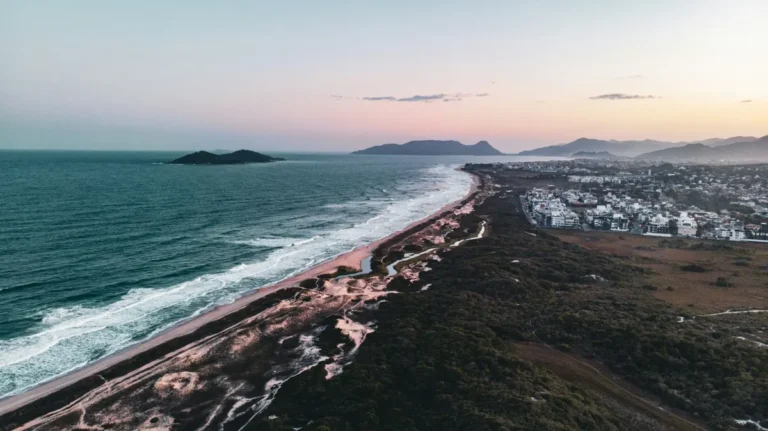 a beach with a town by it