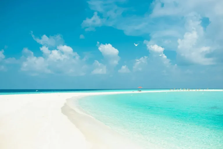 Experience tranquility at this pristine tropical beach with turquoise waters and clear skies.